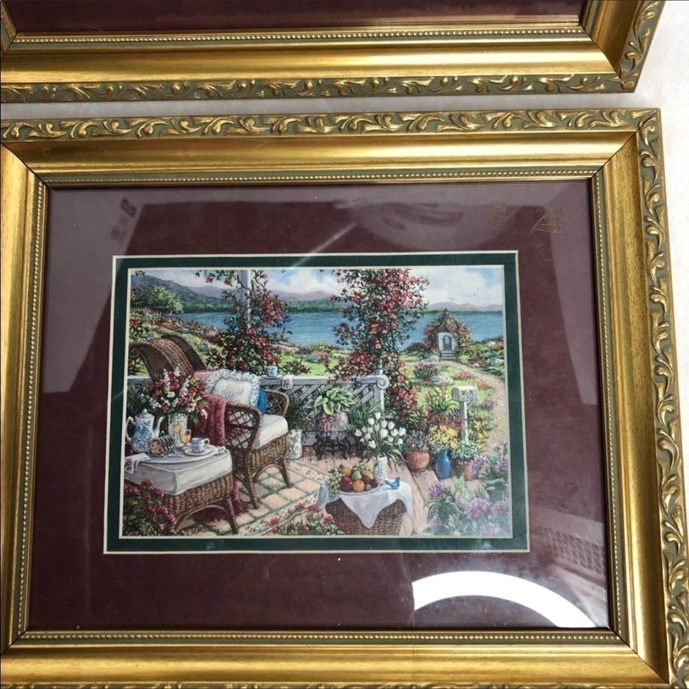 Floral framed art outside seaside cottage